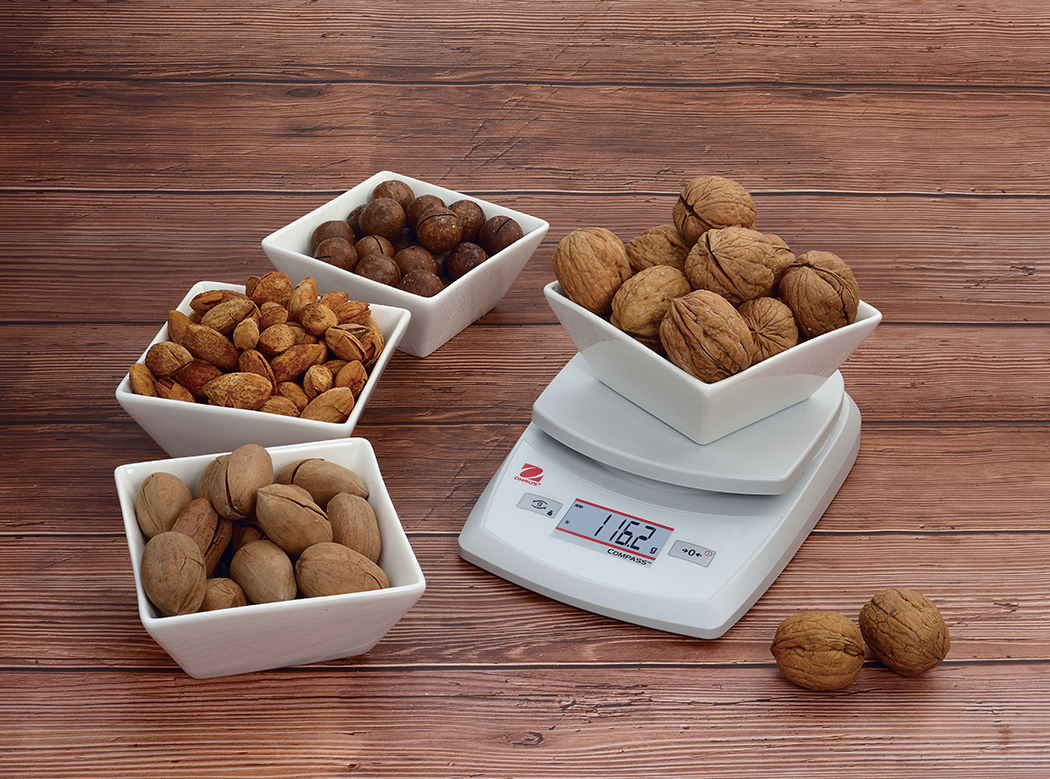 Ohaus Compass CR weighing nuts.